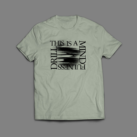 This is a Mindfulness Drill Black On Sage T-Shirt